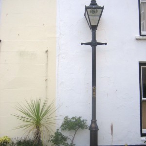 House leaning on a lamp post